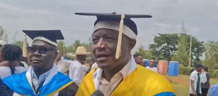 37 years after leaving Mwer Boys, Otare graduates. Schoolmates are clapping